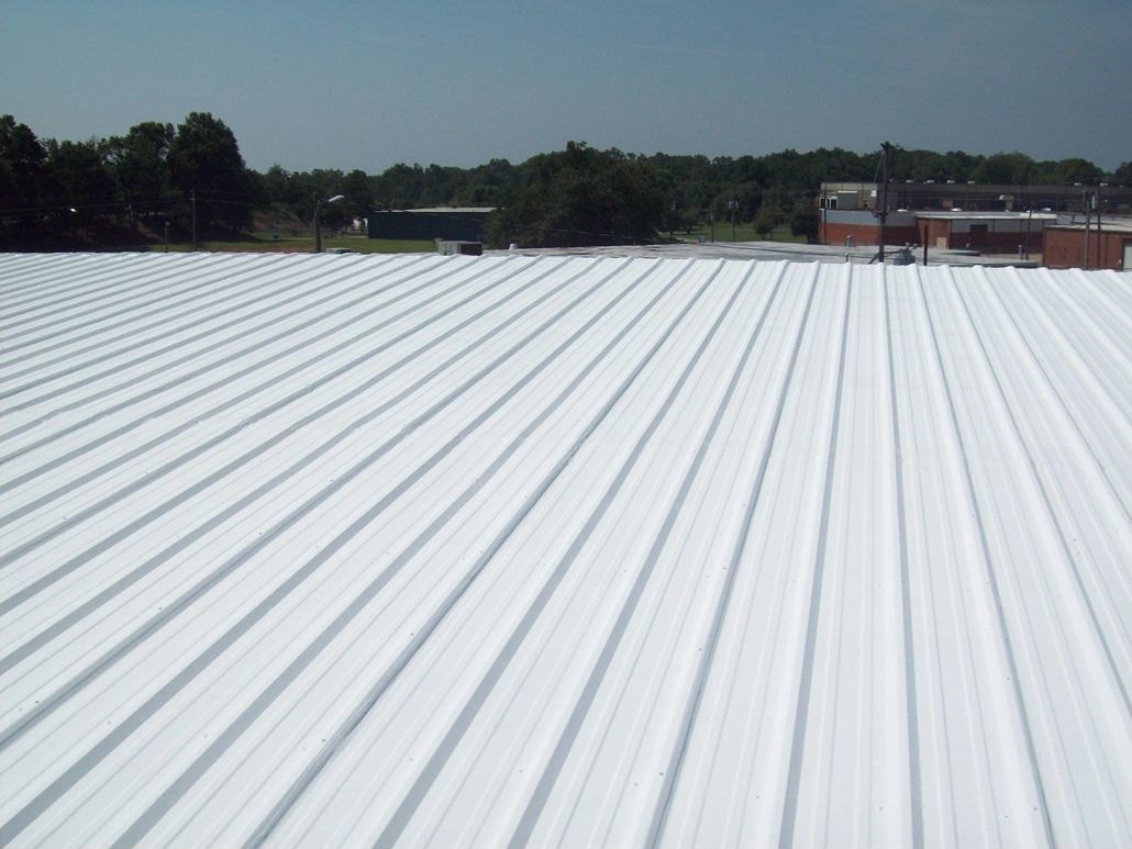 Roof coating before — corrugated metal with rust damage